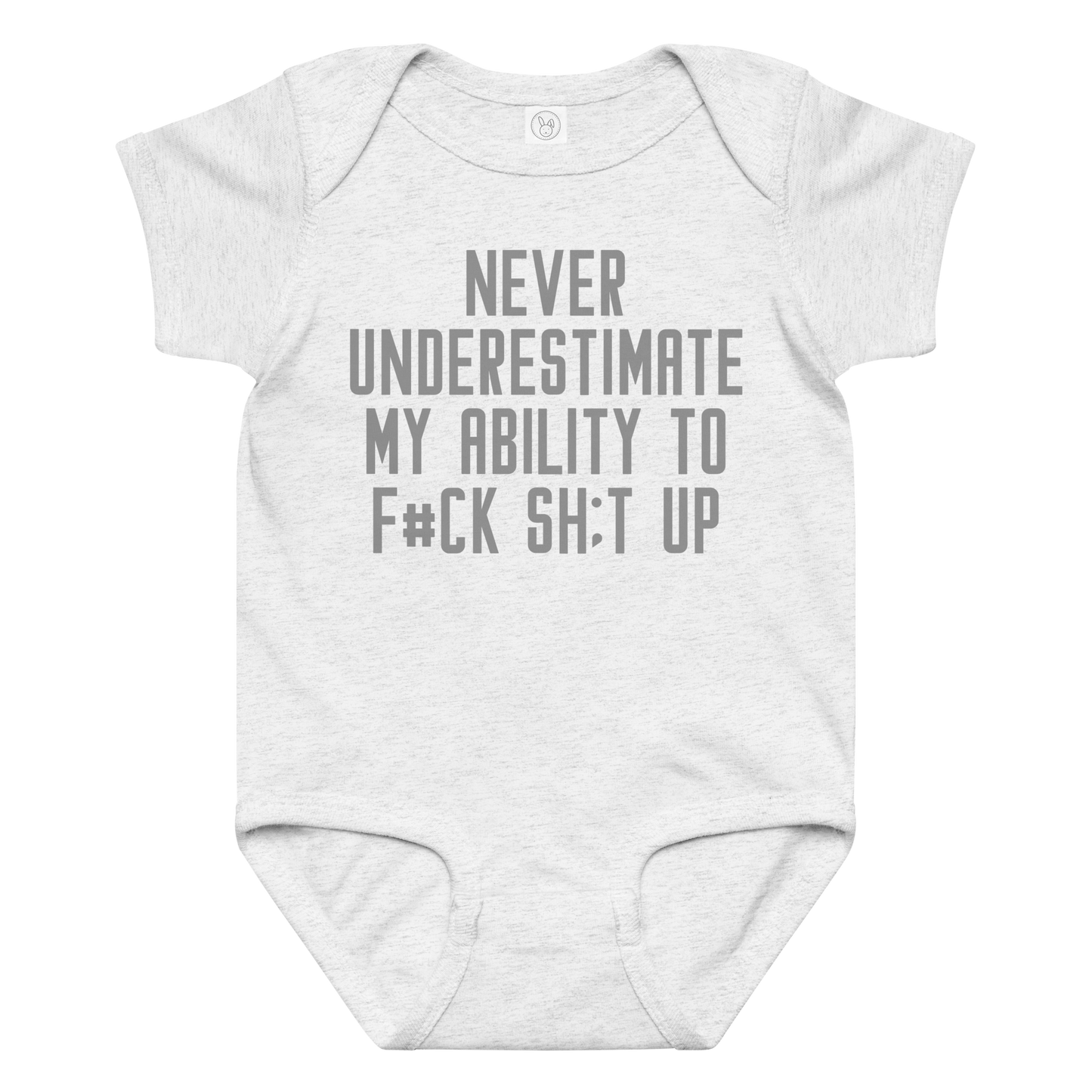 "Never Understimate My Ability To F#Ck Sh:t Up" printed on a ash baby jersey bodysuit laying on a flat surface amongst other clothes