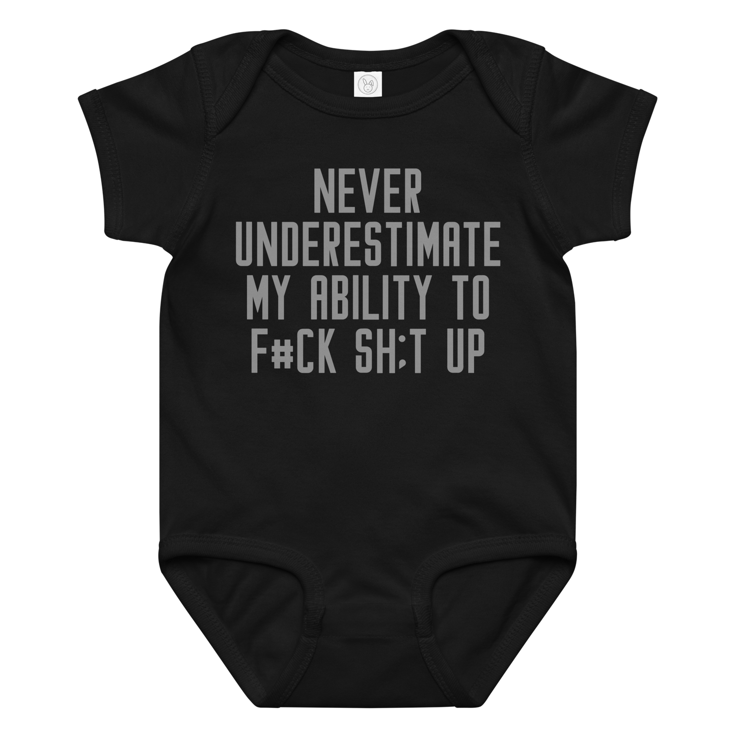 "Never Understimate My Ability To F#Ck Sh:t Up" printed on a black baby jersey bodysuit laying on a flat surface amongst other clothes