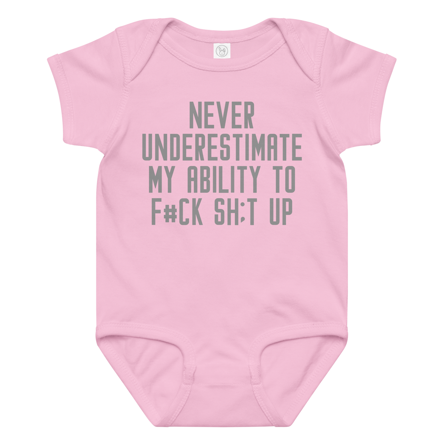 "Never Understimate My Ability To F#Ck Sh:t Up" printed on a pink baby jersey bodysuit laying on a flat surface amongst other clothes
