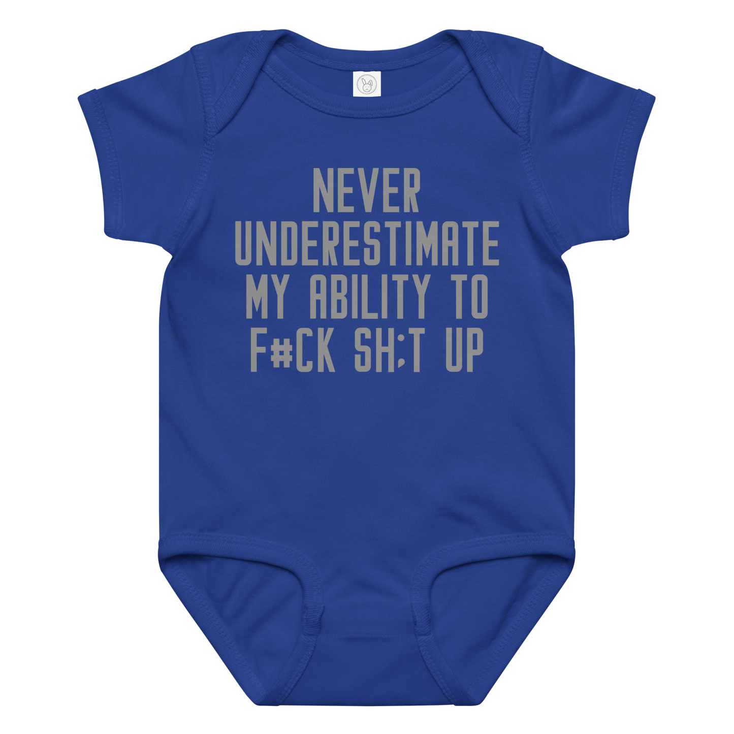 "Never Understimate My Ability To F#Ck Sh:t Up" printed on a royal baby jersey bodysuit laying on a flat surface amongst other clothes