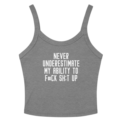 "Never Understimate My Ability To F#Ck Sh:t Up" printed on a athletic heather women's micro-rib tanktop laying on a flat surface amongst sunglasses and shorts