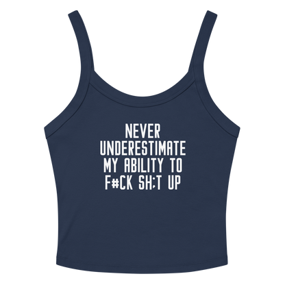 "Never Understimate My Ability To F#Ck Sh:t Up" printed on a solid navy blend women's micro-rib tanktop laying on a flat surface amongst sunglasses and shorts