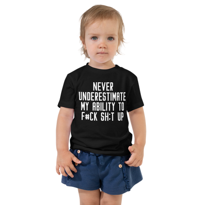 "Never Understimate My Ability To F#Ck Sh:t Up" printed on a black toddler short sleeve tee worn by a female