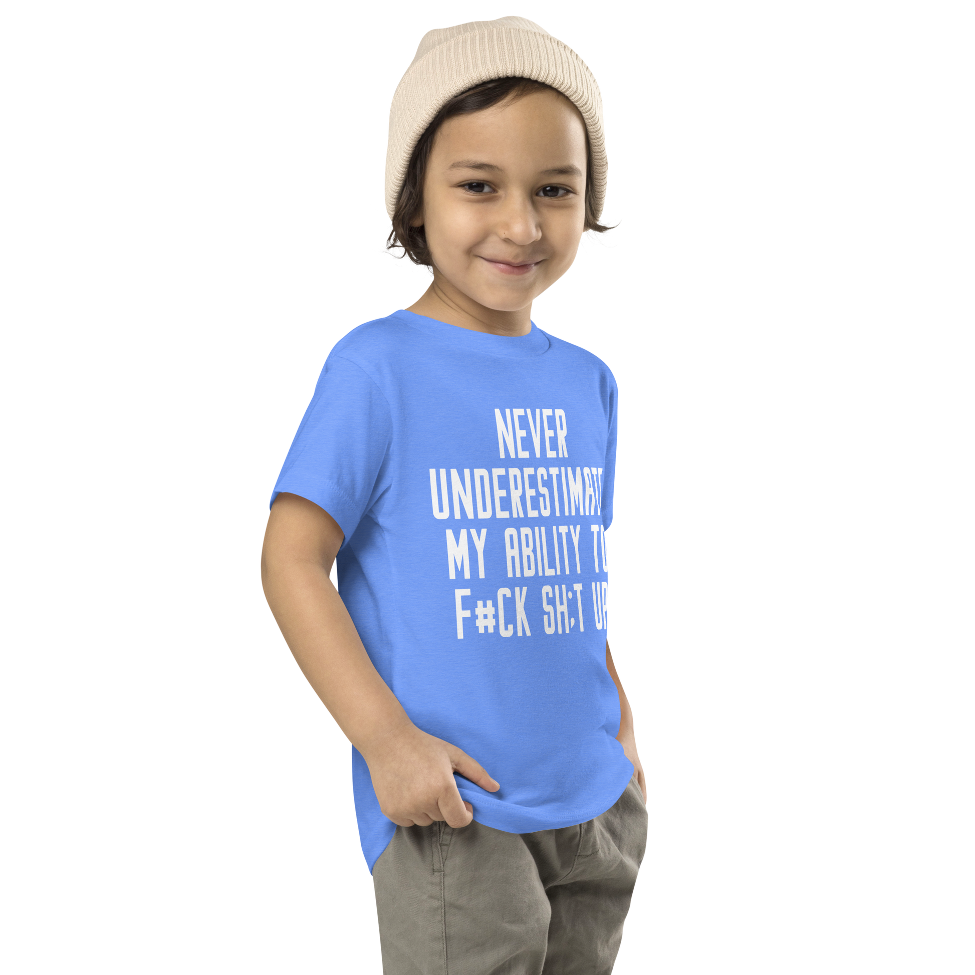"Never Understimate My Ability To F#Ck Sh:t Up" printed on a heather columbia blue toddler short sleeve tee worn by a male who is also wearing a knit cap