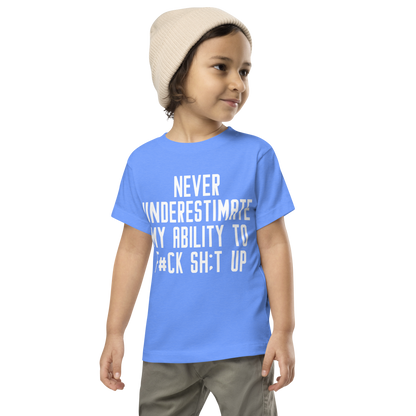 "Never Understimate My Ability To F#Ck Sh:t Up" printed on a heather columbia blue toddler short sleeve tee worn by a male wearing a cap