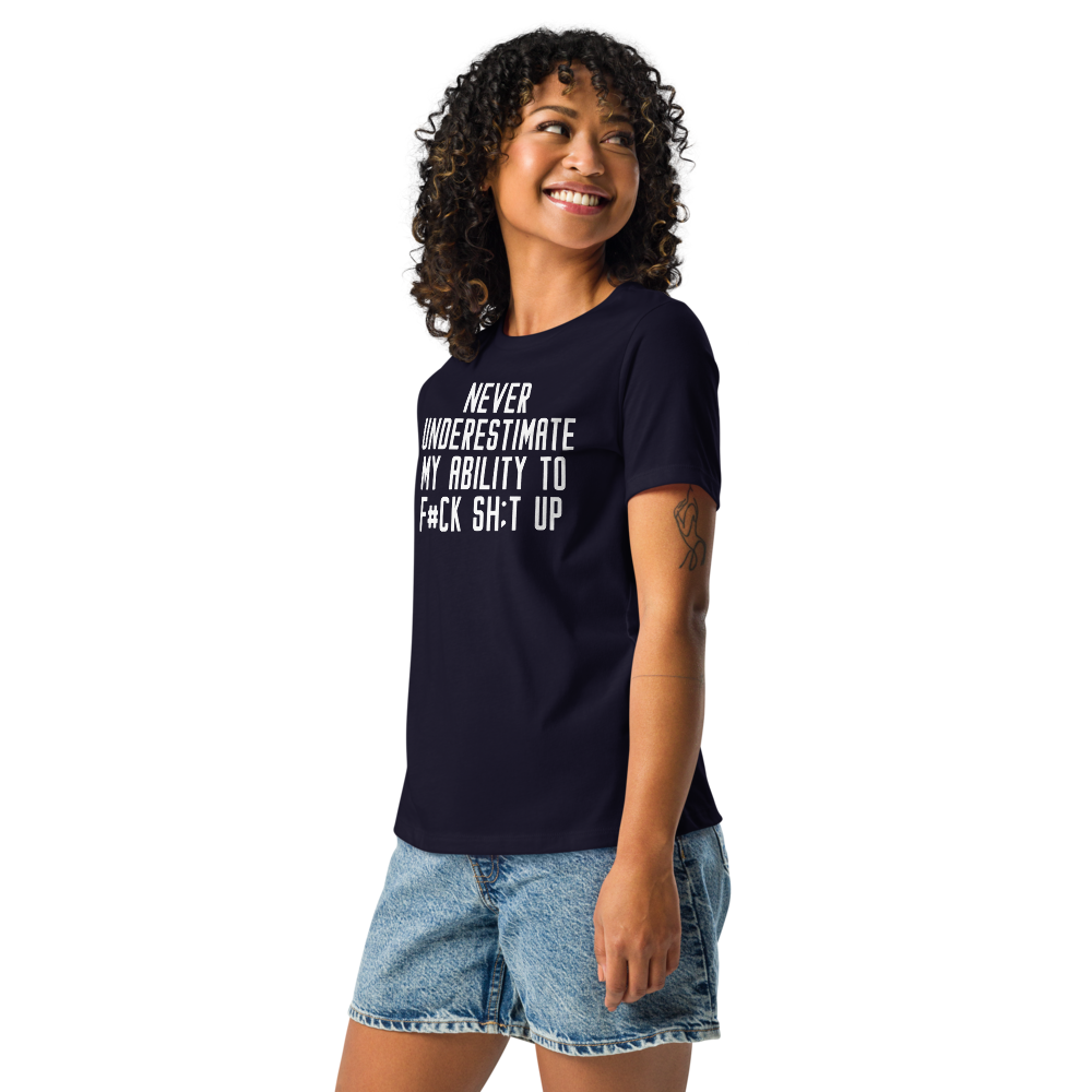 "Never Understimate My Ability To F#Ck Sh:t Up" printed on a navy women's relaxed t-shirt worn by a female
