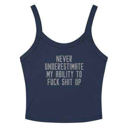 "Never Understimate My Ability To Fuck Shit Up" printed on a solid navy blend women's micro-rib tanktop laying on a flat surface amongst sunglasses and shorts