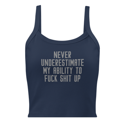 "Never Understimate My Ability To Fuck Shit Up" printed on a solid navy blend women's micro-rib tanktop laying on a flat surface