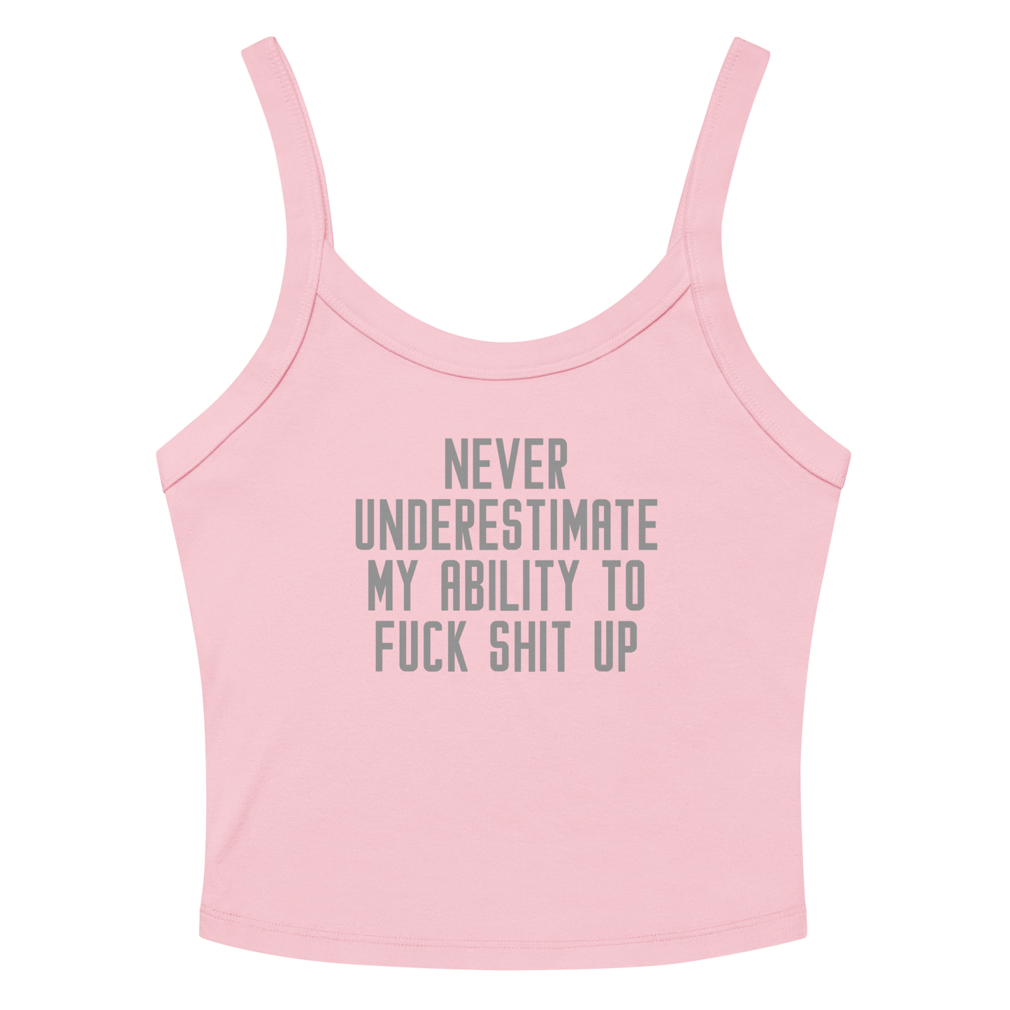 "Never Understimate My Ability To Fuck Shit Up" printed on a solid pink blend women's micro-rib tanktop laying on a flat surface amongst sunglasses and shorts