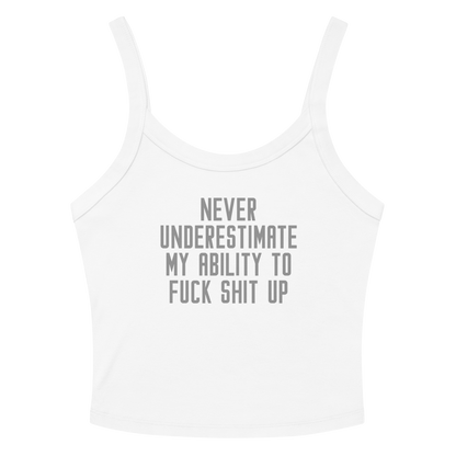 "Never Understimate My Ability To Fuck Shit Up" printed on a solid white blend women's micro-rib tanktop laying on a flat surface amongst sunglasses and shorts