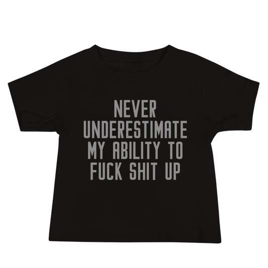 "Never Understimate My Ability To Fuck Shit Up" printed on a black baby jersey short sleeve tee laying on a flat surface