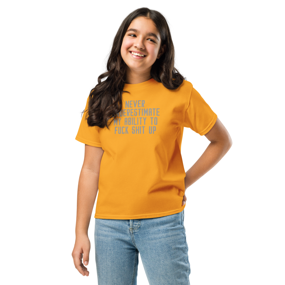 "Never Understimate My Ability To Fuck Shit Up" printed on a gold youth classic tee worn by a female