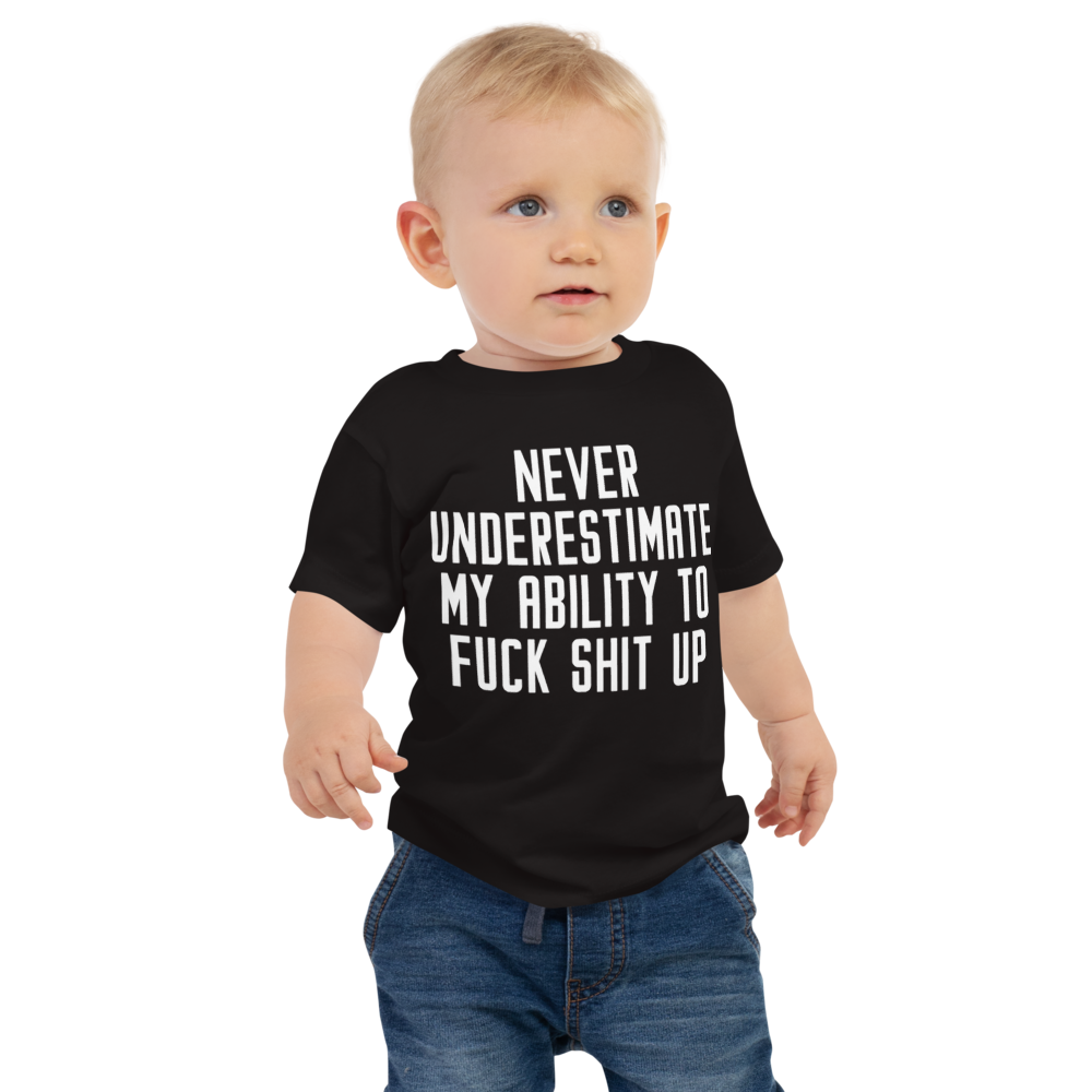 "Never Understimate My Ability To Fuck Shit Up" printed on a black baby jersey short sleeve tee worn by a male