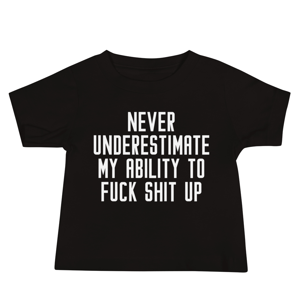 "Never Understimate My Ability To Fuck Shit Up" printed on a black baby jersey short sleeve tee laying on a flat surface