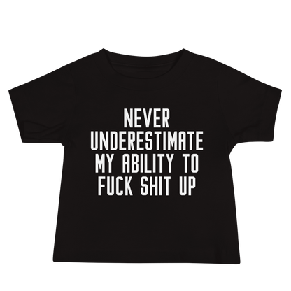 "Never Understimate My Ability To Fuck Shit Up" printed on a black baby jersey short sleeve tee laying on a flat surface