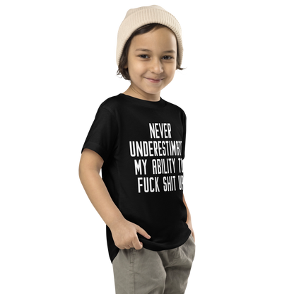 "Never Understimate My Ability To Fuck Shit Up" printed on a black toddler short sleeve tee worn by a male who is also wearing a knit cap
