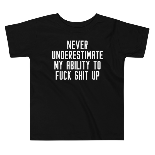 "Never Understimate My Ability To Fuck Shit Up" printed on a black toddler short sleeve tee laying on a flat surface