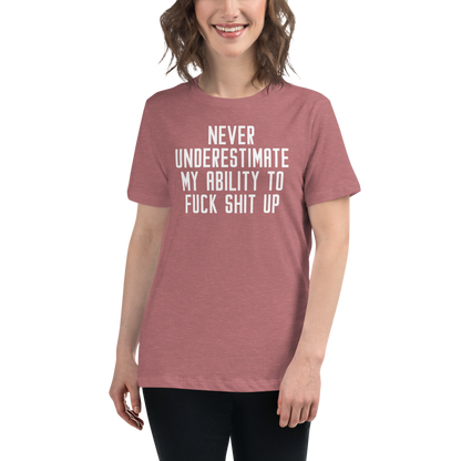 "Never Understimate My Ability To Fuck Shit Up" printed on a heather mauve women's relaxed t-shirt worn by a female
