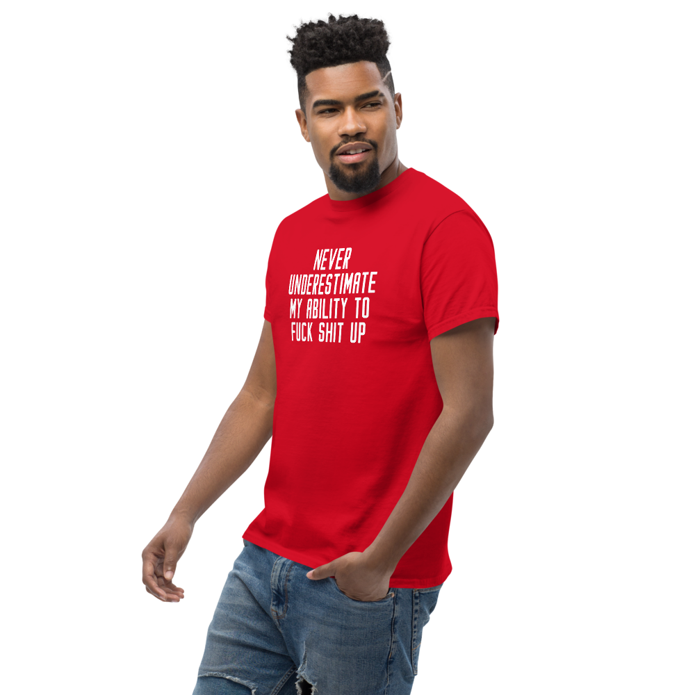 "Never Understimate My Ability To Fuck Shit Up" printed on a red unisex classic tee worn by a male
