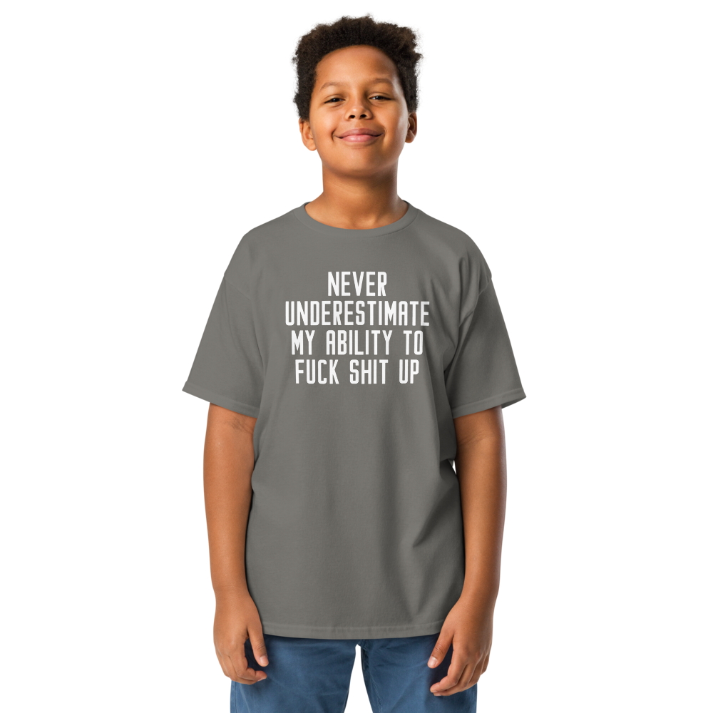 "Never Understimate My Ability To Fuck Shit Up" printed on a charcoal youth classic tee worn by a male