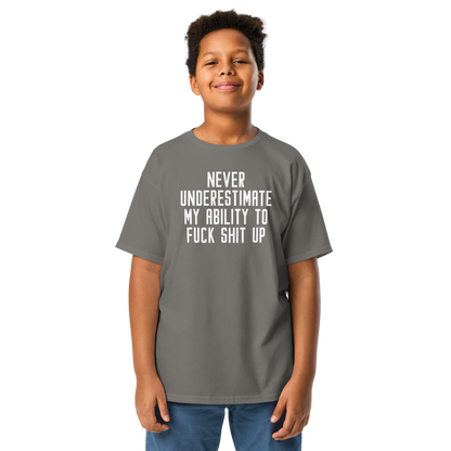 "Never Understimate My Ability To Fuck Shit Up" printed on a charcoal youth classic tee worn by a male