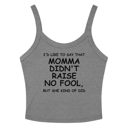 "I'd like to say that momma didn't raise no fool, but she kind of did" printed on a athletic heather women's micro-rib tanktop laying on a flat surface amongst sunglasses and shorts