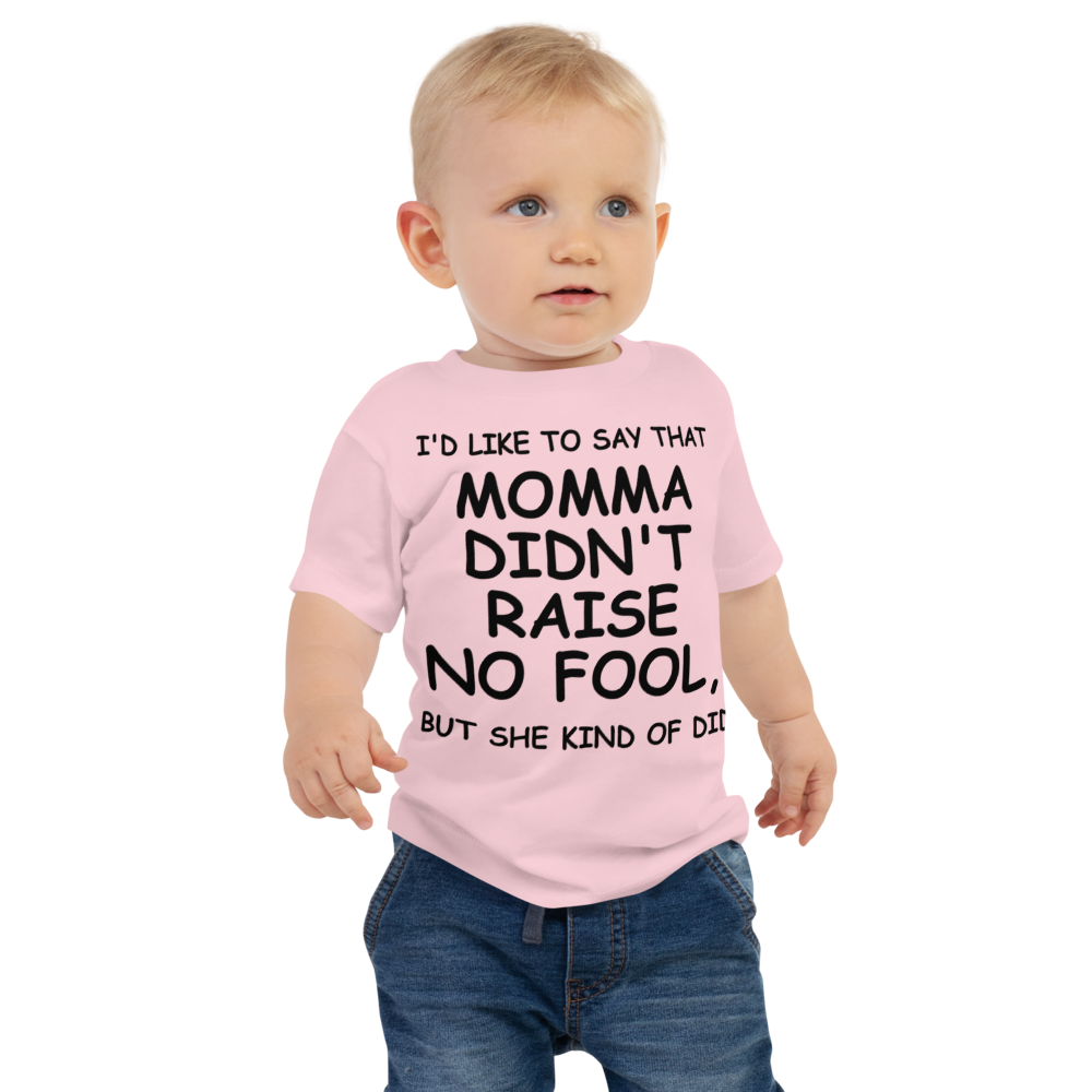 "I'd like to say that momma didn't raise no fool, but she kind of did" printed on a pink baby jersey short sleeve tee worn by a male