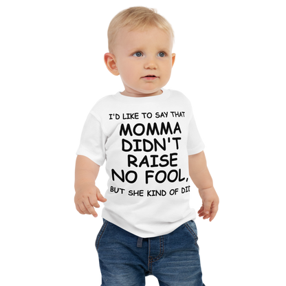 "I'd like to say that momma didn't raise no fool, but she kind of did" printed on a white baby jersey short sleeve tee worn by a male