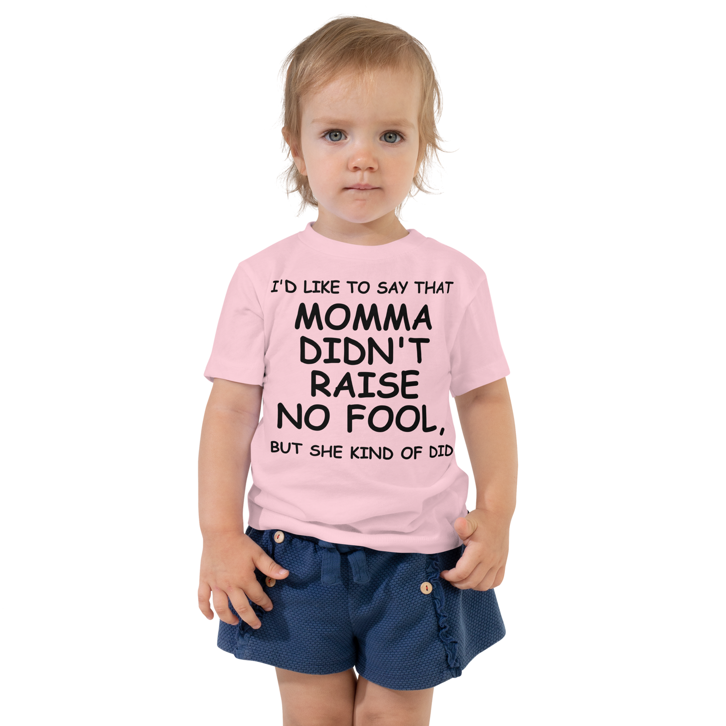 "I'd like to say that momma didn't raise no fool, but she kind of did" printed on a pink toddler short sleeve tee worn by a female