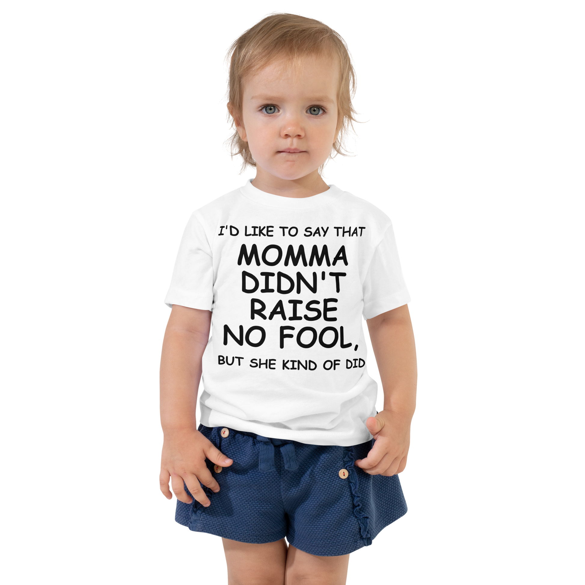 "I'd like to say that momma didn't raise no fool, but she kind of did" printed on a white toddler short sleeve tee worn by a female
