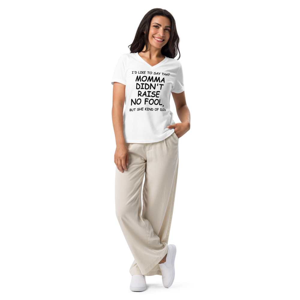 "I'd like to say that momma didn't raise no fool, but she kind of did" printed on a solid white blend women's relaxed v-neck t-shirt worn by a female