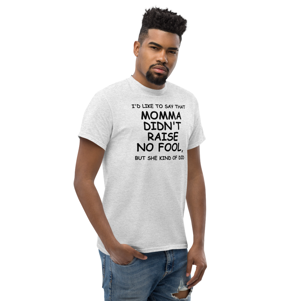 "I'd like to say that momma didn't raise no fool, but she kind of did" printed on a ash unisex classic tee worn by a male