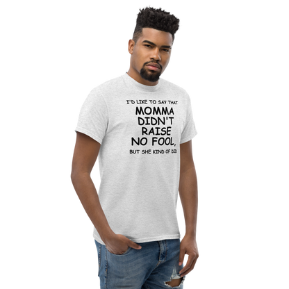 "I'd like to say that momma didn't raise no fool, but she kind of did" printed on a ash unisex classic tee worn by a male