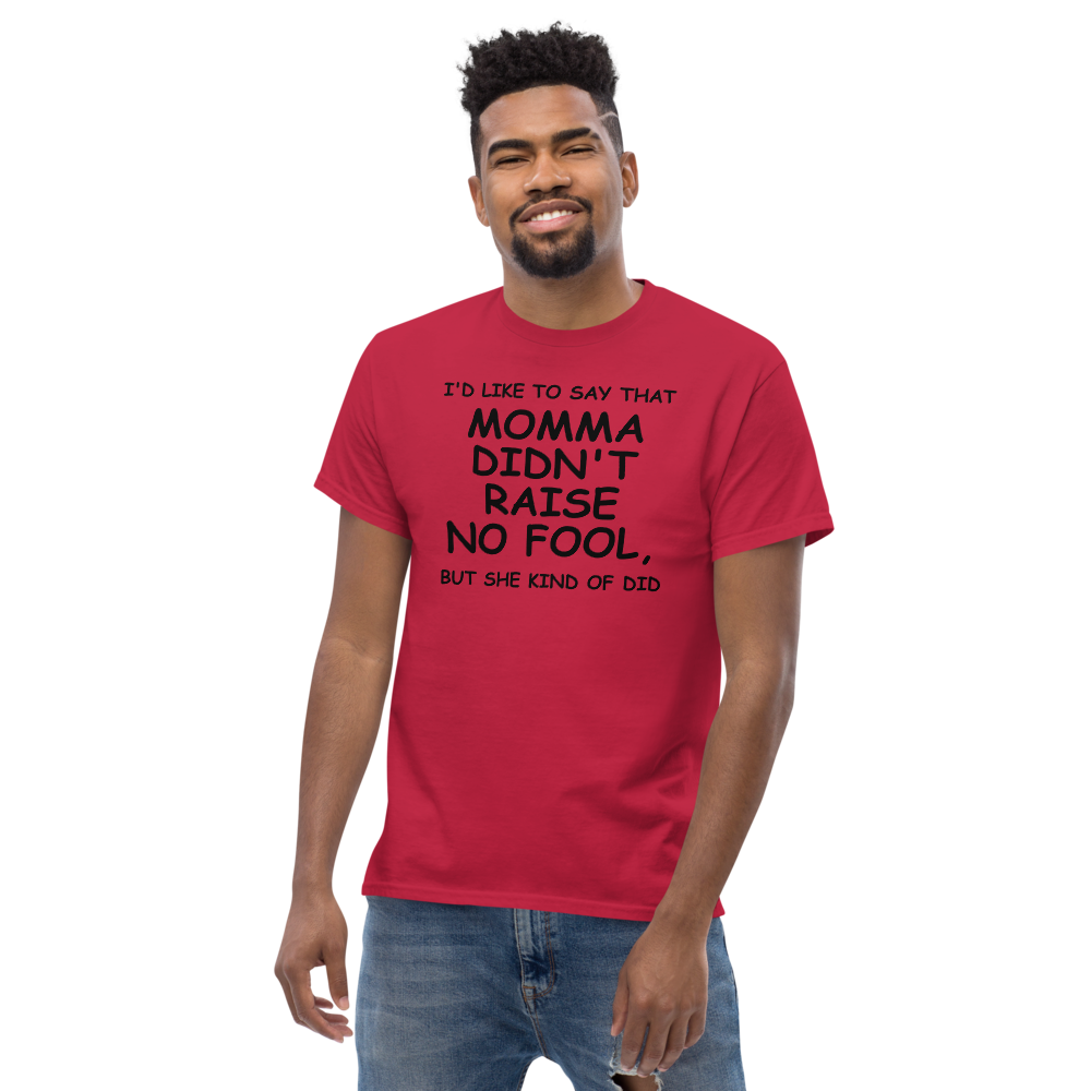 "I'd like to say that momma didn't raise no fool, but she kind of did" printed on a cardinal unisex classic tee worn by a male