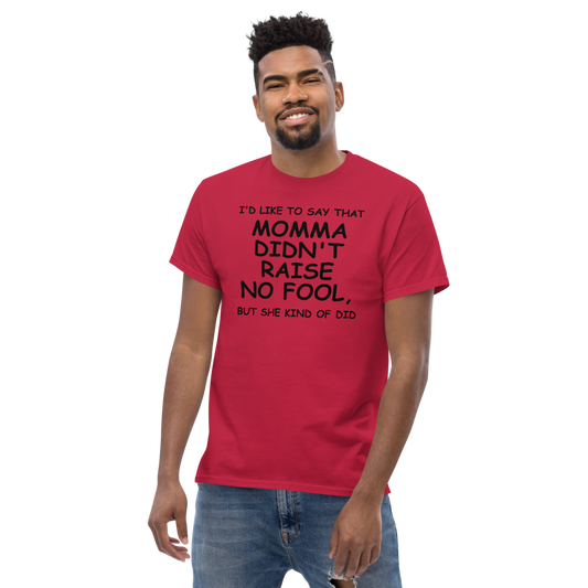 "I'd like to say that momma didn't raise no fool, but she kind of did" printed on a cardinal unisex classic tee worn by a male