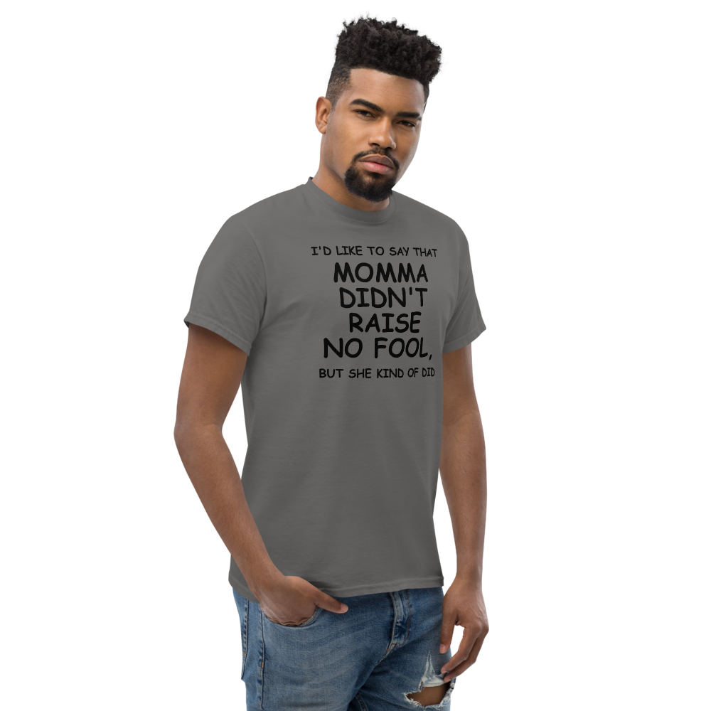 "I'd like to say that momma didn't raise no fool, but she kind of did" printed on a charcoal unisex classic tee worn by a male