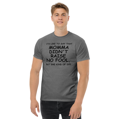 "I'd like to say that momma didn't raise no fool, but she kind of did" printed on a graphite heather unisex classic tee worn by a male