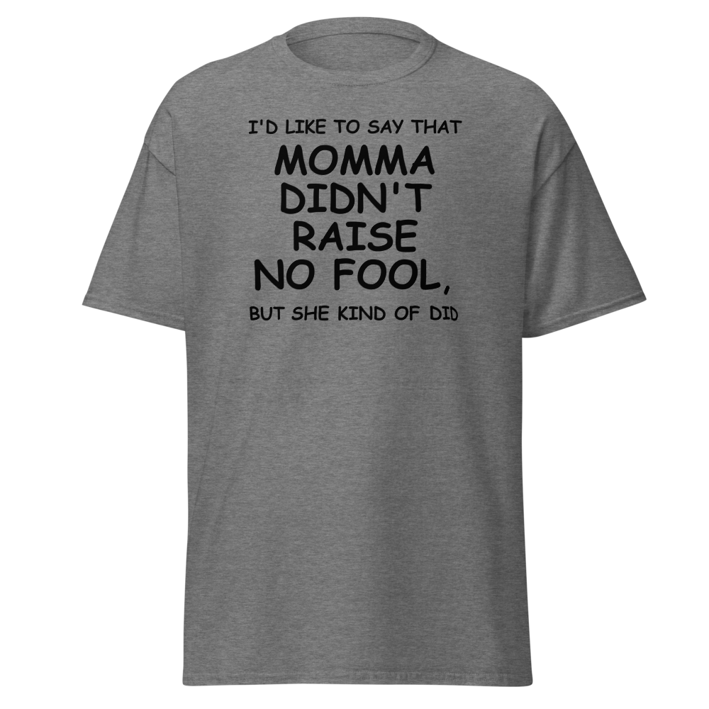 "I'd like to say that momma didn't raise no fool, but she kind of did" printed on a graphite heather unisex classic tee laying on a flat surface