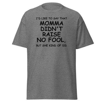 "I'd like to say that momma didn't raise no fool, but she kind of did" printed on a graphite heather unisex classic tee laying on a flat surface