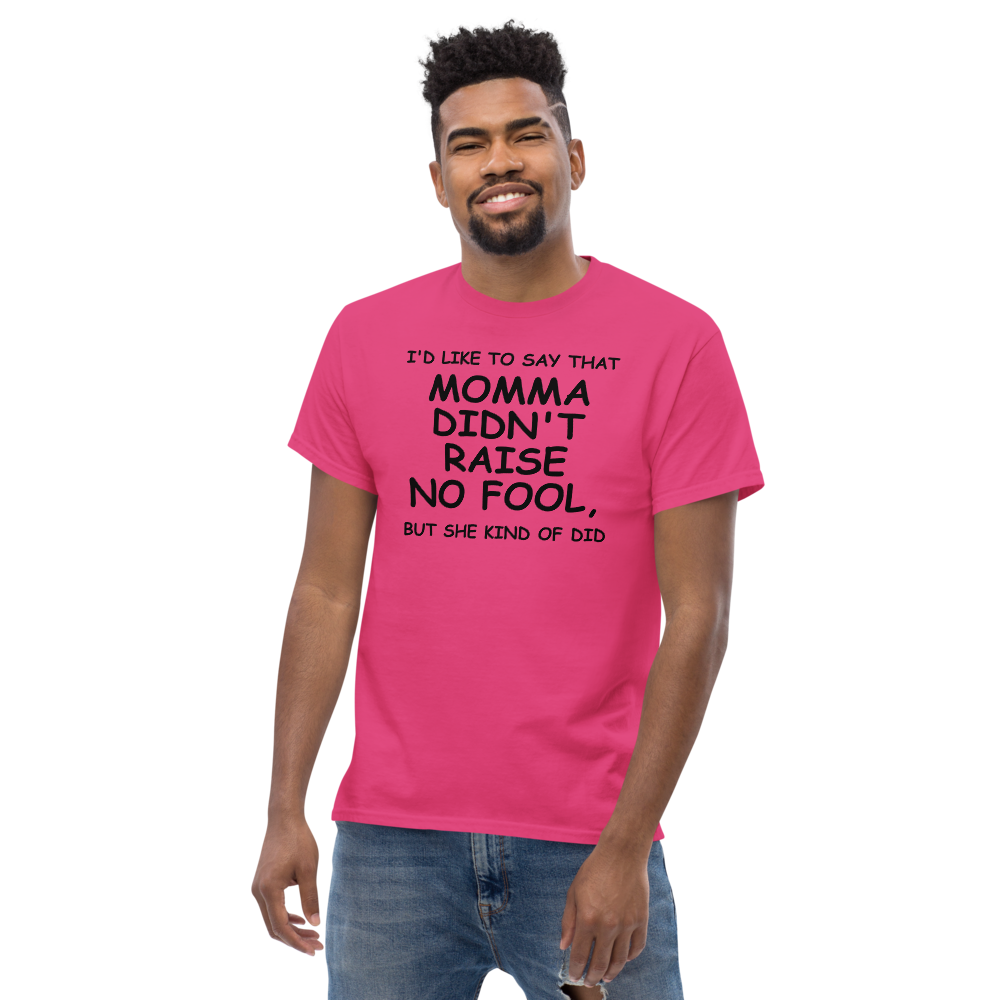 "I'd like to say that momma didn't raise no fool, but she kind of did" printed on a heliconia unisex classic tee worn by a male