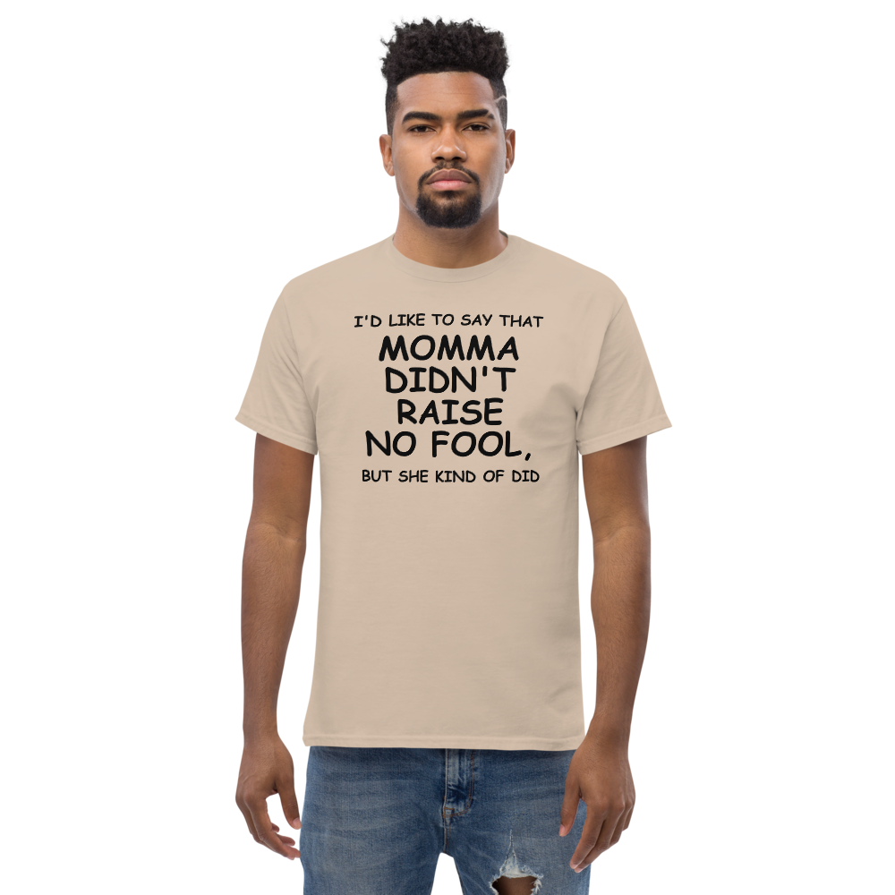 "I'd like to say that momma didn't raise no fool, but she kind of did" printed on a sand unisex classic tee worn by a male