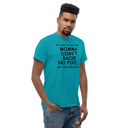 "I'd like to say that momma didn't raise no fool, but she kind of did" printed on a tropical blue unisex classic tee worn by a male