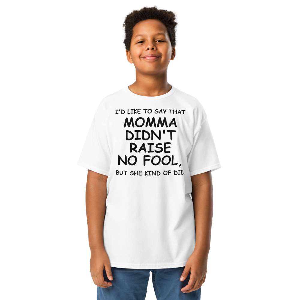 "I'd like to say that momma didn't raise no fool, but she kind of did" printed on a white youth classic tee worn by a male