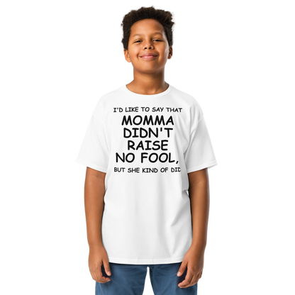 "I'd like to say that momma didn't raise no fool, but she kind of did" printed on a white youth classic tee worn by a male