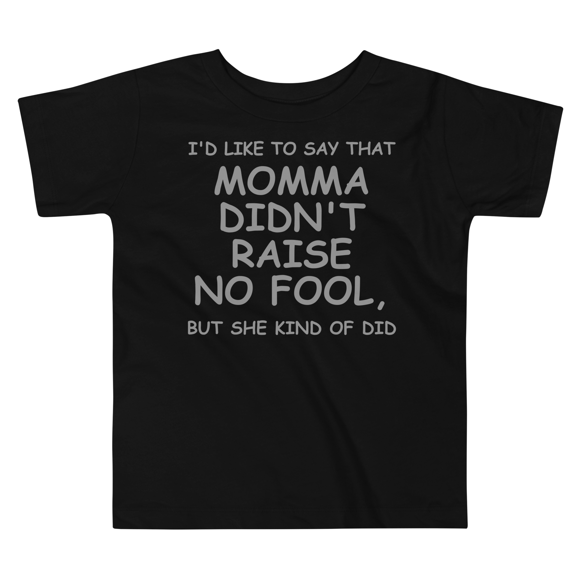 "I'd like to say that momma didn't raise no fool, but she kind of did" printed on a black toddler short sleeve tee laying on a flat surface