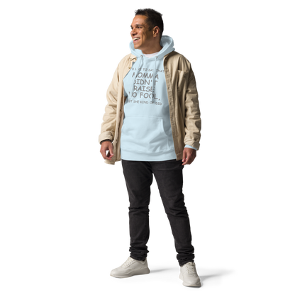 "I'd like to say that momma didn't raise no fool, but she kind of did" printed on a sky blue unisex hoodie worn by a male with a jacket on top