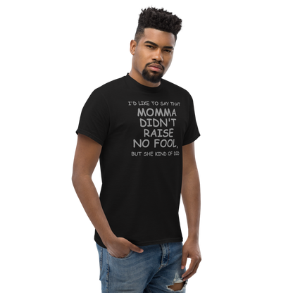 "I'd like to say that momma didn't raise no fool, but she kind of did" printed on a black unisex classic tee worn by a male