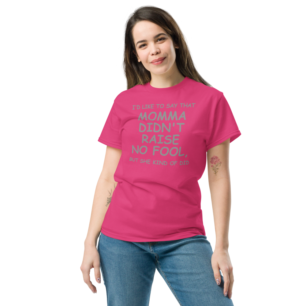 "I'd like to say that momma didn't raise no fool, but she kind of did" printed on a heliconia unisex classic tee worn by a female