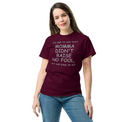 "I'd like to say that momma didn't raise no fool, but she kind of did" printed on a maroon unisex classic tee worn by a female