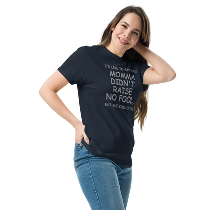 "I'd like to say that momma didn't raise no fool, but she kind of did" printed on a navy unisex classic tee worn by a female